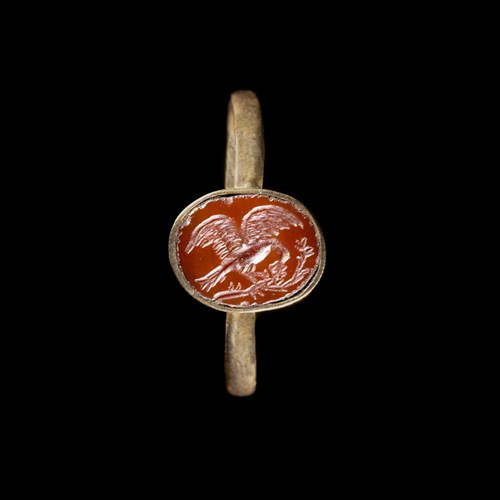 A gold ring set with a Roman red jasper intaglio. Eagle.